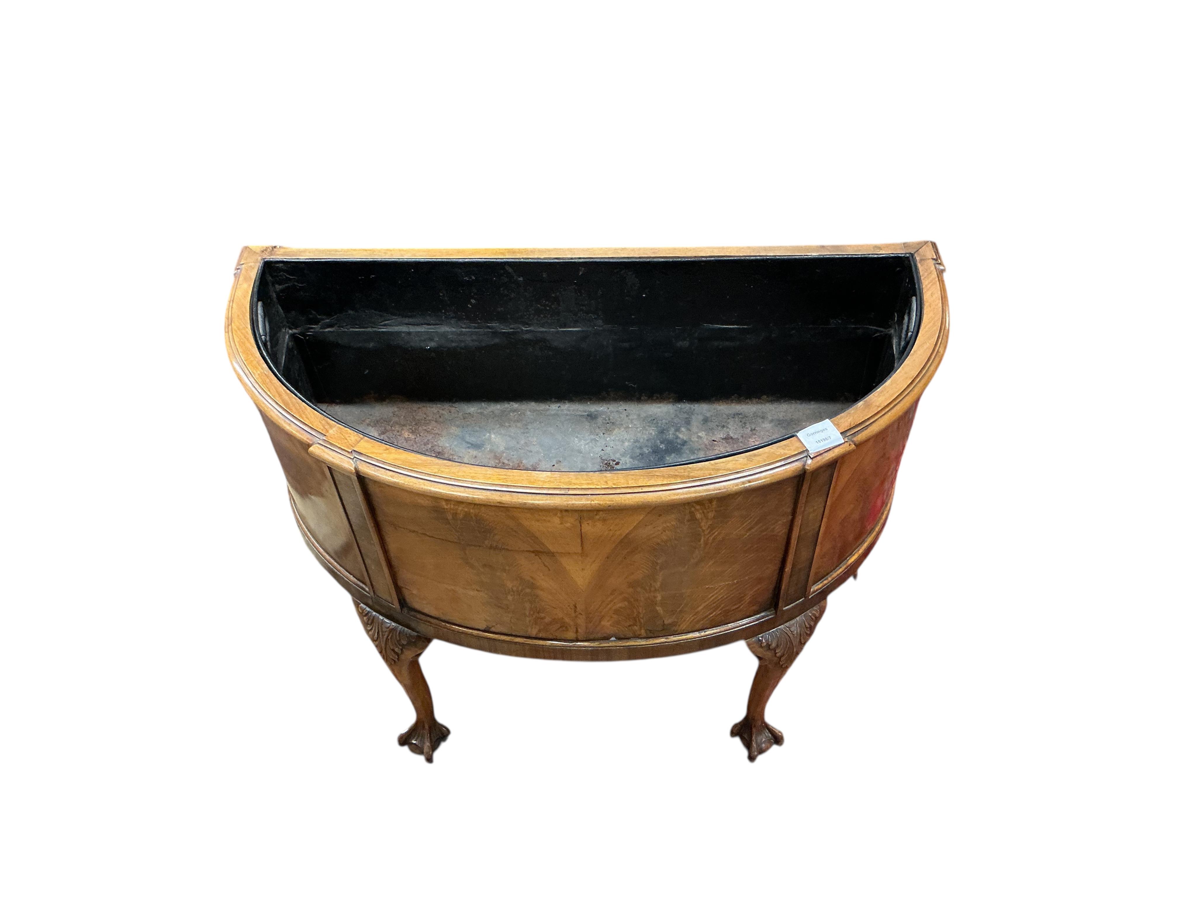 A Queen Anne Revival walnut bowfront jardiniere, width 86cm, depth 40cm, height 69cm